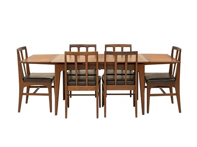Lot 259 - A mid-century teak dining table and six chairs.