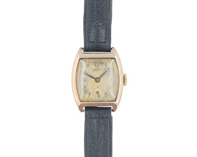 Lot 1001 - A 1930's 9k rose gold Tonneau cased gentleman's mid-sized manual wind wristwatch.