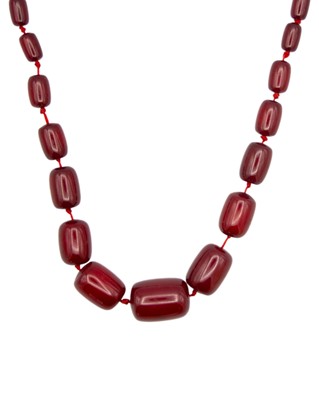 Lot 170 - A cherry amber-style graduated bead necklace.