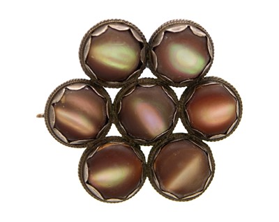 Lot 173 - An antique silver, brown Mother-of-Pearl, coque de perle, brooch.