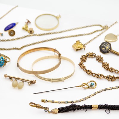 Lot 22 - A selection of 9k gold bronze core bangles and other gold-plated jewellery.