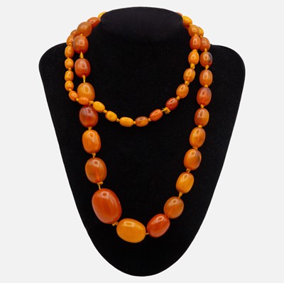 Lot 37 - A butterscotch amber-style graduated bead necklace.