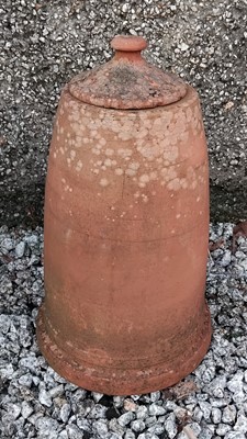 Lot 883 - A terracotta rhubarb forcer with lid.