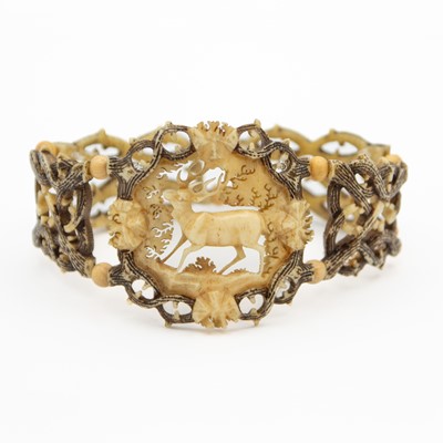 Lot 23 - A Black Forest carved antler stretchable bracelet.