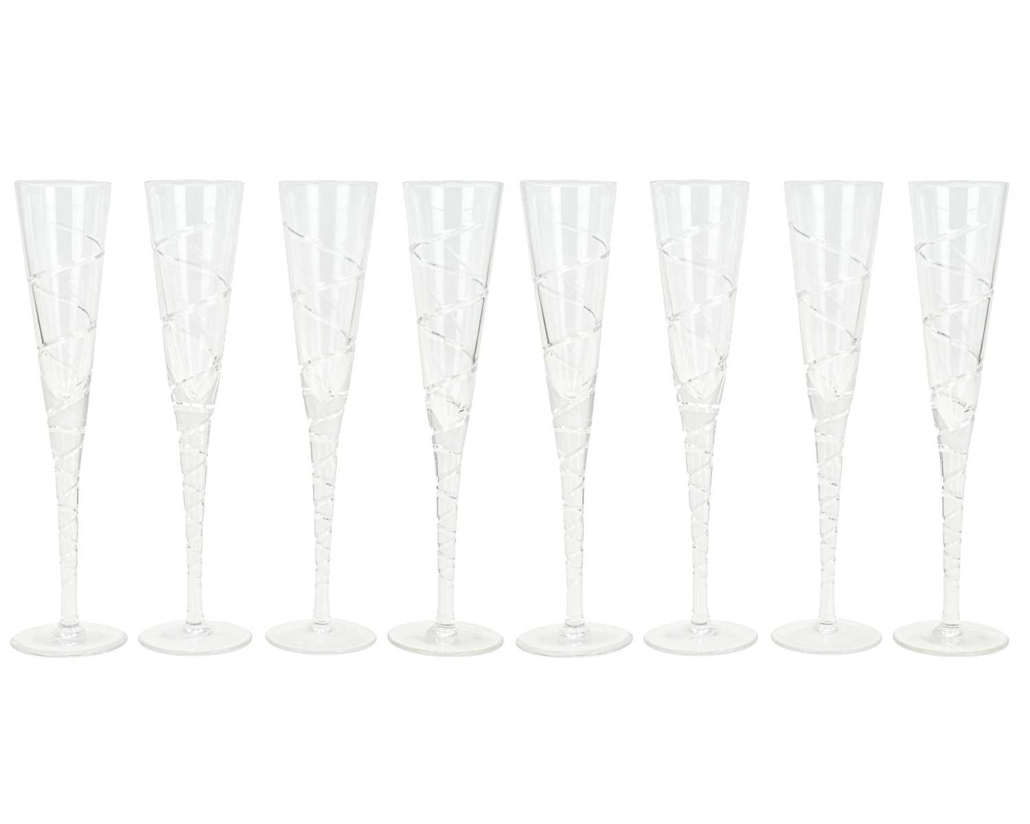 Lot 290 - A set of eight Jasper Conran for Stuart Crystal 'Aura' pattern champagne flutes.