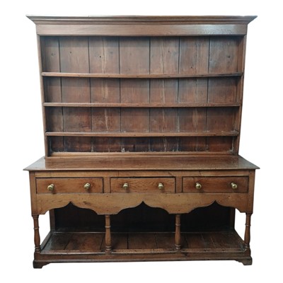 Lot 796 - A George III oak dresser.