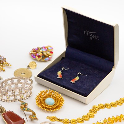 Lot 27 - A selection of named costume jewellery items.