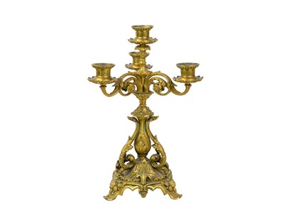 Lot 34 - A pair of French ormolu three branch candelabra.