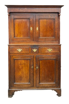 Lot 709 - A George III Welsh oak deuddarn cupboard.