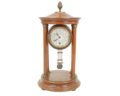 Lot 889 - A German portico mantel clock.