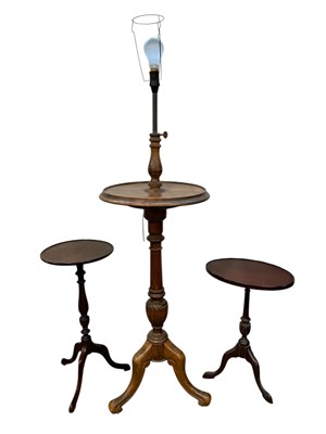 Lot 970 - A mahogany and stained beech tripod lamp table.