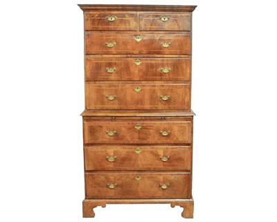 Lot 730 - An 18th century walnut chest on chest.