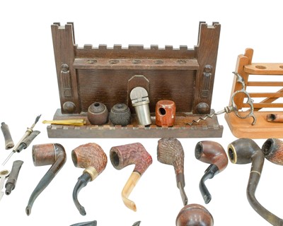 Lot 20 - A castellated oak pipe rest, width 29cm.