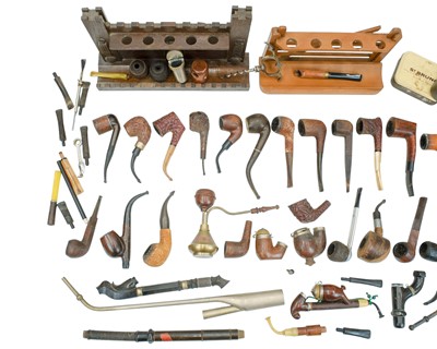 Lot 20 - A castellated oak pipe rest, width 29cm.