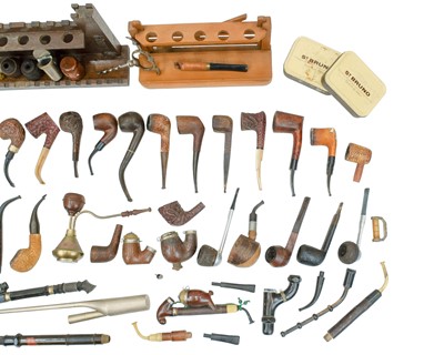 Lot 20 - A castellated oak pipe rest, width 29cm.