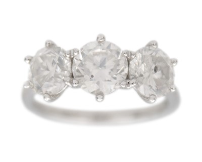 Lot 201 - A platinum 3.24ct diamond set three-stone ring.