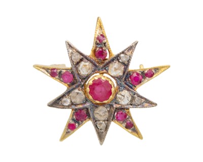 Lot 195 - A Victorian-style silver gilt diamond and ruby set star brooch