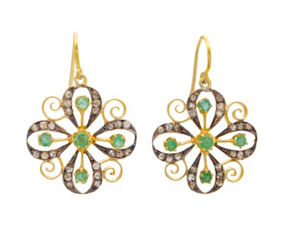 Lot 205 - A pair of silver gilt, emerald, and diamond pendant earrings.