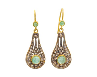Lot 215 - A pair of silver gilt diamond and emerald pear-shaped drop earrings.
