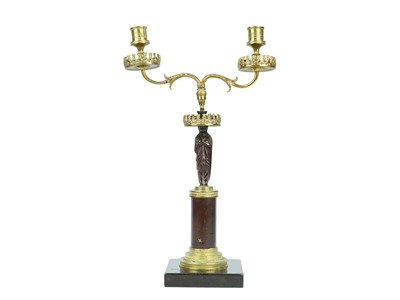 Lot 52 - A bronze and ormolu figural candelabrum.