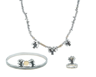 Lot 247 - A silver and high-purity gold tree motif suite.
