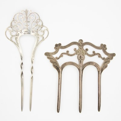 Lot 44 - Two large Edwardian silver hair slides/combs.