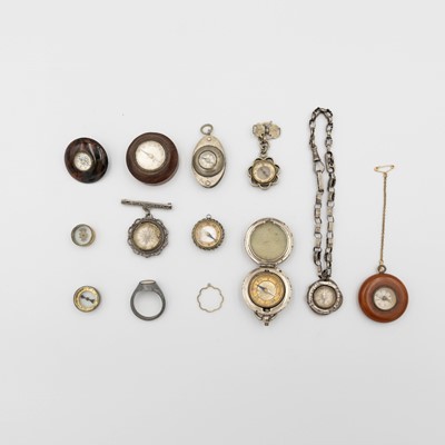 Lot 236 - An interesting collection of compasses, including fobs, brooches and pocket compasses.