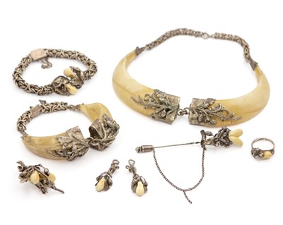 Lot 42 - A selection of German silver boar tusk and deer tooth set jewellery items.