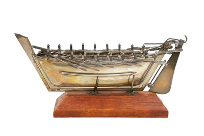 Lot 413 - A Middle Eastern silver model of a rowing boat.