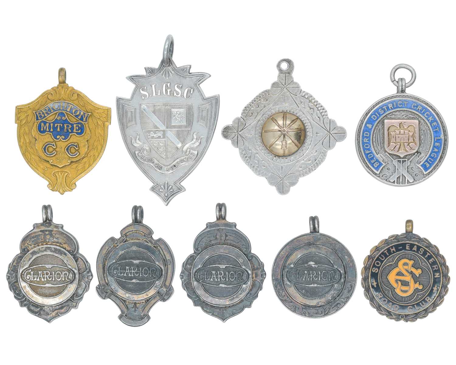 Lot 1115 - A collection of seven silver fobs, and two