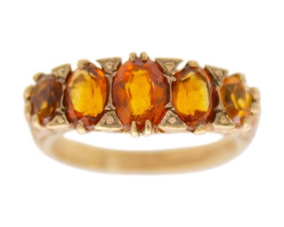 Lot 206 - A 9k gold graduated five-stone citrine ring.