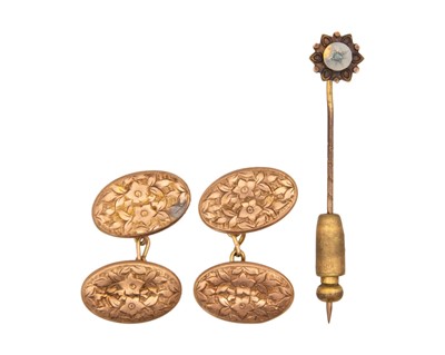 Lot 207 - A pair of 9k gold floral motif engraved cufflinks and a stick pin set a diamond.