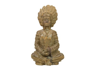 Lot 669 - An American carved softwood figure of a seated native American chief.