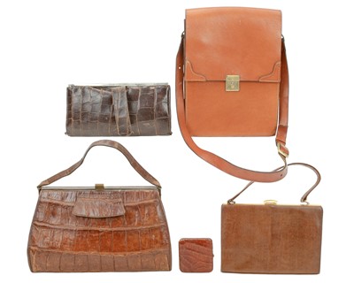 Lot 558 - A crocodile skin handbag with matching purse.