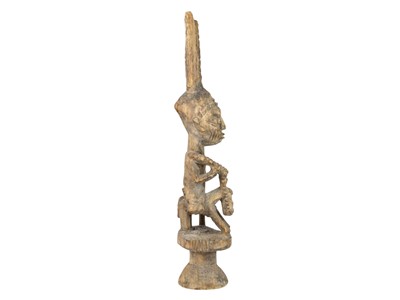 Lot 9 - A carved tribal figure.