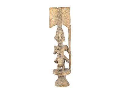 Lot 9 - A carved tribal figure.