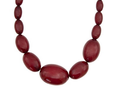 Lot 218 - A cherry amber-style bakelite choker.
