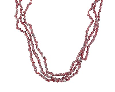 Lot 123 - A 19th-century three-strand garnet choker with a 14k gold clasp.
