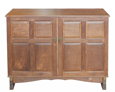 Lot 700 - An oak Arts and Crafts Cotswold school sideboard.