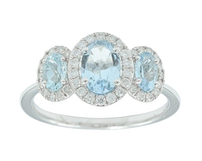 Lot 233 - An attractive 9k white gold aquamarine and diamond set triple cluster ring.