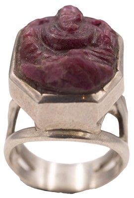 Lot 48 - A carved ruby depicting Ganesha, in a silver ring.