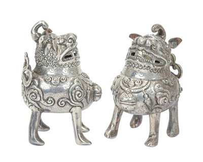Lot 421 - A pair of Chinese silver foo dogs.