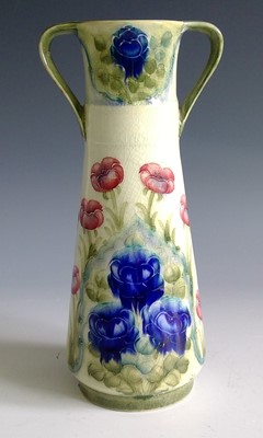 Lot 800 - A William Moorcroft twin handled vase,...