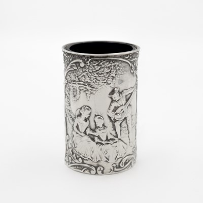 Lot 218 - An Edwardian silver vase embossed with three figures in a garden, by Henry Matthews.
