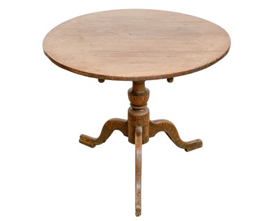 Lot 737 - A George III oak tripod table.