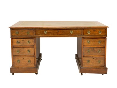 Lot 932 - An Edwardian mahogany twin pedestal desk.