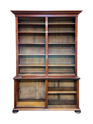 Lot 974 - A mahogany two part open bookcase.