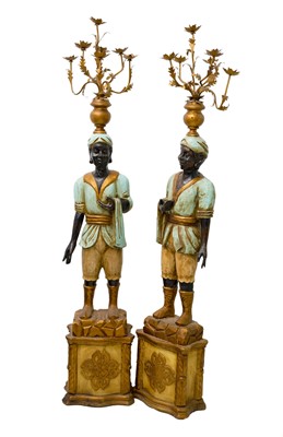 Lot 925 - Two Blackamoor type figural floor-standing candelabra.