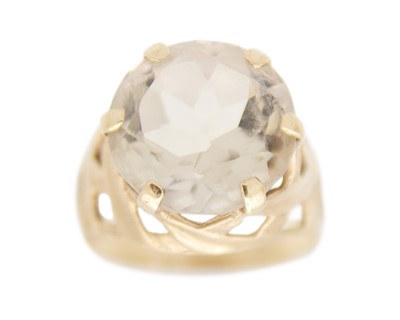 Lot 231 - A 9k gold with a smokey quartz dress ring.