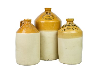 Lot 681 - Three Redruth stoneware flagons.